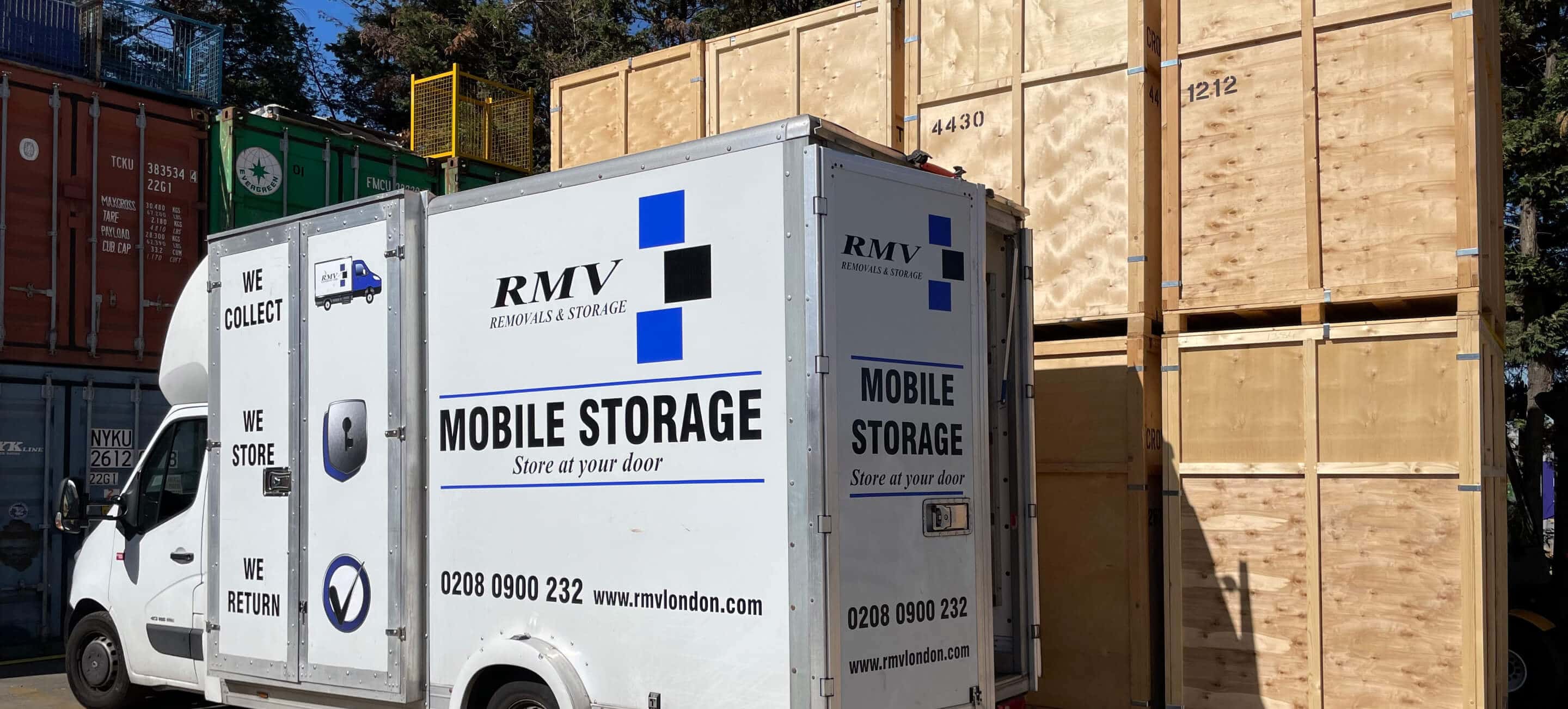 RMV mobile storage van in front of stacked storage containers