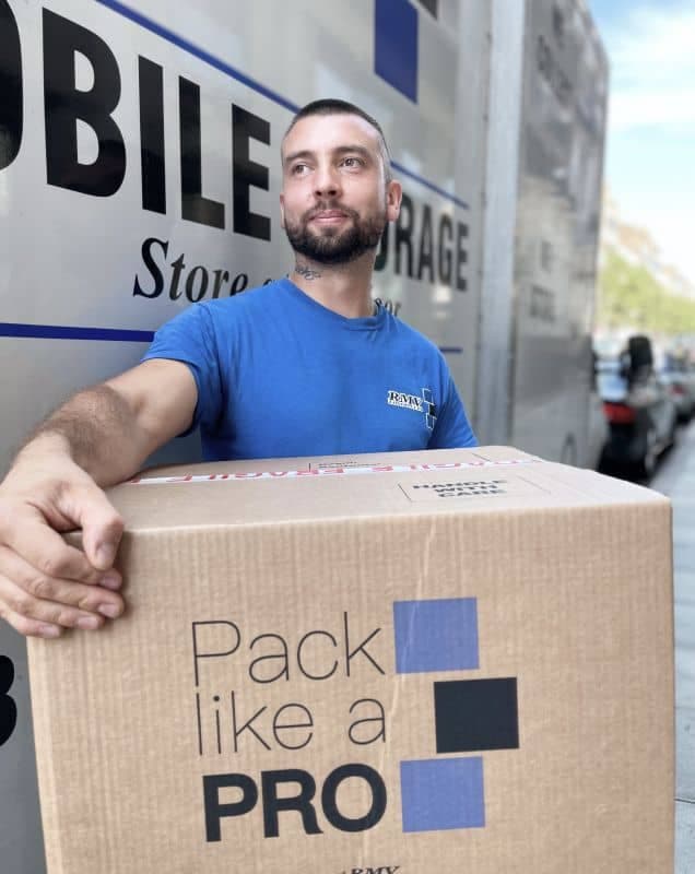 RMV mover carrying a packed Pack Like a PRO box out of the removal van in London